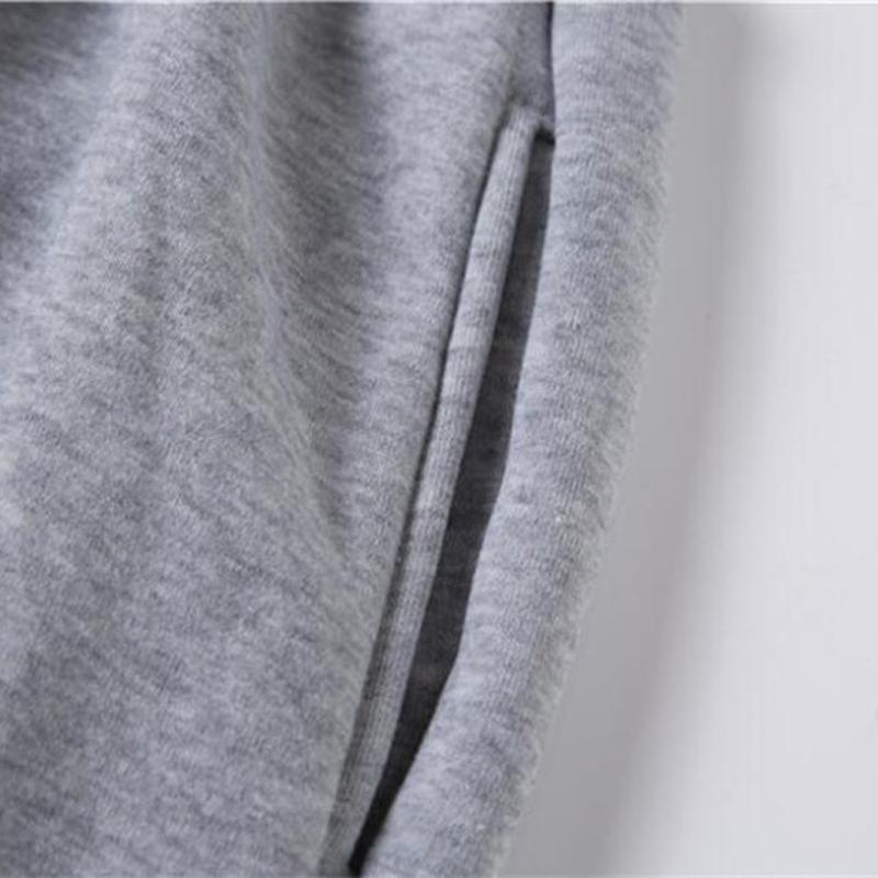 Pantalon de sport décontracté et chaud à bandes à la cheville